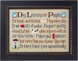 Dog lovers live here model stitched over two on 32 ct. Lizzie Kate Dog Lessons For People Cross Stitch Pattern 143 123stitch