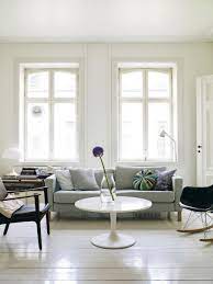 10 Sneaky Ways To Make A Small Space Look Bigger The Everygirl Small Room Design Bright Living Room Small Spaces