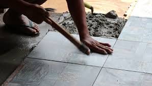Laying adhesive floor tiles on concrete. Worker Putting Cement Gum And Stock Footage Video 100 Royalty Free 25475960 Shutterstock