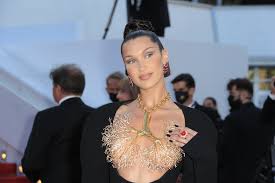 Последние твиты от bella hadid (@bellahadid). Bella Hadid Is Daring In A Peek A Boo Dress Lung Necklace At Cannes Footwear News