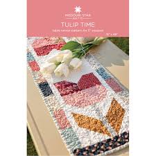 Quilted table runners add elegance to your dining room table or your coffee table at any time during the year. Tulip Time Table Runner Pattern By Missouri Star Missouri Star