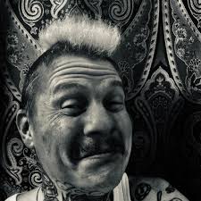 This is Justin. Justin knows what you did and when you did it but he will  never tell because he's like that. Be nice to his friends. His eyes say  "murder" but