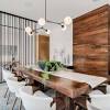 A modern dining area featuring a bar area with white modish bar stools set on the hardwood flooring. 3