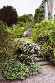 Arabella Lennox Boyd S Magical Garden Is A Rare And Worthy Tribute To A Lifetime S Work Garden Front Of House Cottage Garden Terraced Landscaping