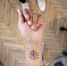 A tattoo that wraps around like a bracelet. 40 Beautiful Tiny Wrist Tattoos For Women Tattooblend