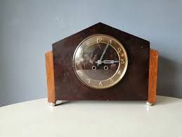 pin on amsterdamse school pendules met glasdeurtje