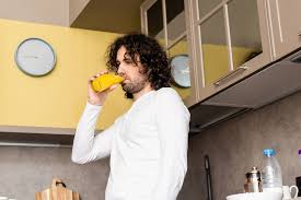 #foryoupage #fyp #baldguydrinkingorangejuicememe #baldy #bald @noah_escamilla @nibaclan. Low Angle View Of Thoughtful Man Drinking Orange Juice While Standing In Kitchen Free Stock Photo And Image