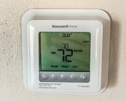 Tap the lock symbol visible on the thermostat's display. Facebook