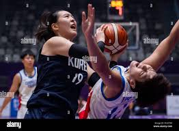 Jakarta. 30th Aug, 2018. Park Jisu (L) of team Korea competes during  women's basketball semifinals between Chinese Taipei and the unified team  of the Democratic People's Republic of Korea and South Korea