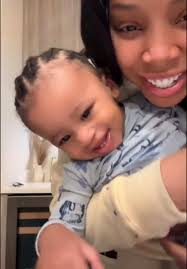 Keisha Louise Boyfriend Holding Her As A Baby