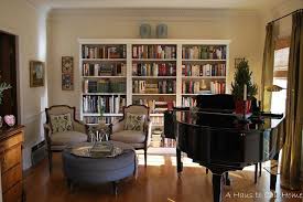Bookshelves Against The Back Wall Upright Piano Not Baby Grand With Two Chairs And Game Table In Fro Grand Piano Room Piano Living Rooms Home Library Rooms