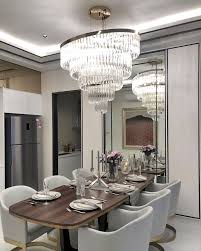 Chandeliers make grand statements in entry halls and foyers. Give Your Dining Room The Makeover It Deserves With These Fresh And Modern Lighting Design Modern Lighting Design Dining Room Decor Luxury Lighting Chandeliers