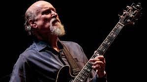 I would call it cool, groovy, edgy, instrumental guitar with a funky jazz club sound. 6 Essential John Scofield Albums