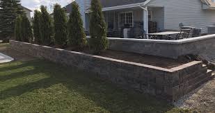 Planter and tree on patio. Patio Retaining Wall Project By Brett At Menards