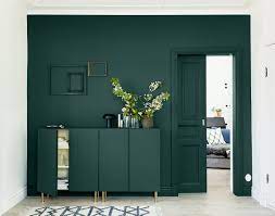 This Designer Trick Will Make Any Small Space Look Larger Dark Green Living Room Green Furniture Living Room Living Room Green