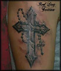 Praying hands with a cross besides a rosary, a cross is yet another element that enhances the beauty of a religious tattoo and is quite popular even if solely inked. Tatto Wallpapers Roman Catholic Cross Tattoos
