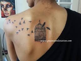 Flying Bird Tattoo On Ribs Birds With Bird Cage And Feather Tattoo Design Cage Tattoos Bird Shoulder Tattoos Bird Tattoo Collarbone