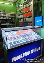 Desain ini sebagai alternatif untuk menciptakan kesan modern dan mewah meski bangunan berdiri di luas lahan yang terbatas. Etalase Hp Samsung Modern Untuk Counter Toko Warga Mulya Cellular