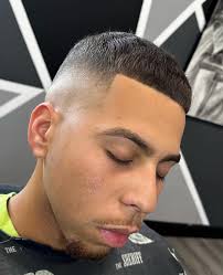 Mid/ high fade with dark, natural verticals. Make sure to book your  appointments via link in our bio! 💈 Cut by @nick_the_barber_