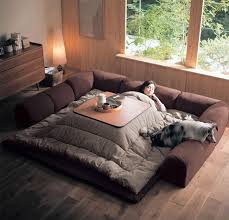 Never Leave Your Bed Again With This Awesome Japanese Invention Japanese Living Rooms Japanese Home Decor Asian Home Decor