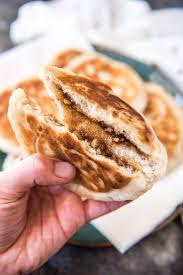 A Korean Sweet Pancake Called Hotteok Filled With Brown Sugar Cinnamon And Walnuts Inside A Ball Of Dough That G Hotteok Recipe Food Korean Hotteok Recipe