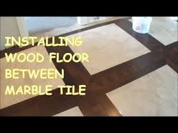 How To Install Prefinished Hardwood Floor Between Marble Tile Mr Flooring Hardwood Floors Prefinished Hardwood