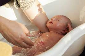 Line the tub or sink with a clean towel. Baby S Bath What You Do And Don T Need Cafemom Com