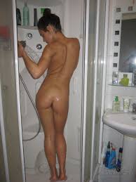 Nubile and nude teen babe posing in the bathroom