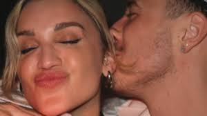 Ashley Roberts, 42, goes Instagram official with toy-boy George Rollinson,  25, as artist plants a kiss