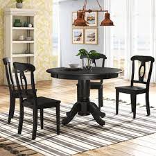 A rustic dining table can be the perfect finish for a minimalist dining room. Dark Wood Dining Set Wayfair
