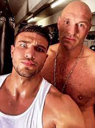 Tommy is a professional boxer like his older brother (image: Inside Brothers Tommy And Tyson Fury S Trip To Miami With Private Jets Bikini Clad Girls And Boxing Sessions