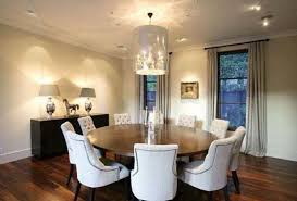 A circular dining table that expands when rotated. Expandable Large Round Dining Room Tables With Chairs Fantastic Modern Formal Large Round Dining Room Round Dining Room Table Walnut Dining Room Round Dining