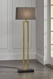 Duncan Brass Floor Lamp With Grey Shade A Smoky Grey Shade Adds Moody Ambiance To Duncan Our Chic Unique Floor Floor Lamp Unique Floor Lamps Brass Floor Lamp