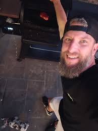 Grilled pork chops, baked potato, and mixed veggies