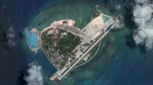 Chinese officials say the efforts are no different from public construction projects. South China Sea Dispute China Lands Bombers On Island Bbc News