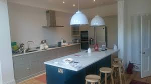 Many island kitchens boast this kind of layout, having the oven elsewhere in the kitchen. Woodstock Free Standing Shaker And Reclaimed Pine Wood Kitchens