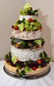 One of the best wedding cake flavor combinations, this rich chocolate cake with cappuccino mousse that's a lovely a southern classic wedding cake flavor, featuring a cocoa red cake with cream cheese filling. Cheese Tower Alternative To Wedding Cake Cheese Wedding Cake Unusual Wedding Cakes Wedding Cake Alternatives