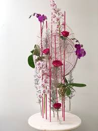 happy friday appreciating this unique arrangement with a touch of roses cymbidi modern flower arrangements modern floral arrangements floral art arrangements