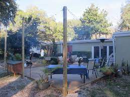 How To Hang String Lights In Backyard