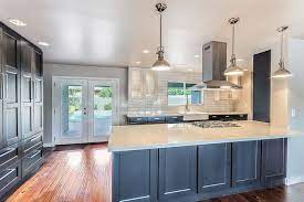In this simple, classic kitchen makeover the lower cabinets were painted out with a dark grey and the uppers kept fresh and white. 33 Blue And White Kitchens Design Ideas Designing Idea