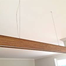 To hang a heavy object from the ceiling, such as a chair or a hammock, it is necessary to secure the supporting hooks directly into the structure of the building. Timber Beam Pendant Light Gap Lighting Designs Linear Lights
