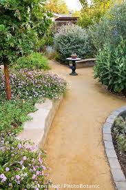 Goldfines Decomposed Granite Crushed Rock Path In California Backyard Drought Tolerant Ga Beautiful Gardens Small Backyard Landscaping Landscaping With Rocks