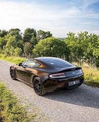 Image result for Marron Black 2017 Aston Martin