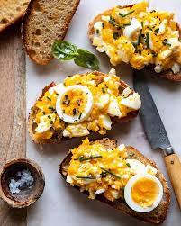 Dad S Cheesy Eggs On Buttered Toast The New Years Day Breakfast Worth Waking Up For Especially If Half Baked Harvest Recipes Cheesy Eggs Half Baked Harvest
