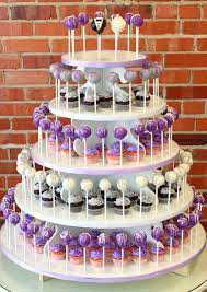 Purple And White Cake Pop Tower With Cupcakes For A Wedding Wedding Cake Pearls Fall Wedding Cupcakes Wedding Cupcakes