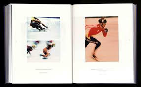 ONE BY ONE, THE SKATERS GLIDE INTO THEIR STARTING POSITIONS, SHAKING THE  LAST JITTERS FROM THEIR POWERFUL LEGS AS THE ANNOUNCER