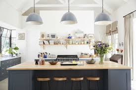 This elegant and spacious kitchen has two large islands, under modern lamps, with small shelf space on their sides. The Kitchen Island Size That S Best For Your Home Bob Vila