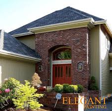 Inteplast deck in grey is the perfect match to a red brick house. Exterior Paint Colors That Go With Red Brick