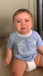 Moment gummy one-year-old desperate for a bite of his mom's sandwich gets  frustrated