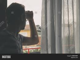 Silhouette Of Lonesome Man Looking Through The Window Image Stock Photo 238157221 7.the man stood there in the middle of the street with the deserted dawnlit boulevard telescoping out behind him.